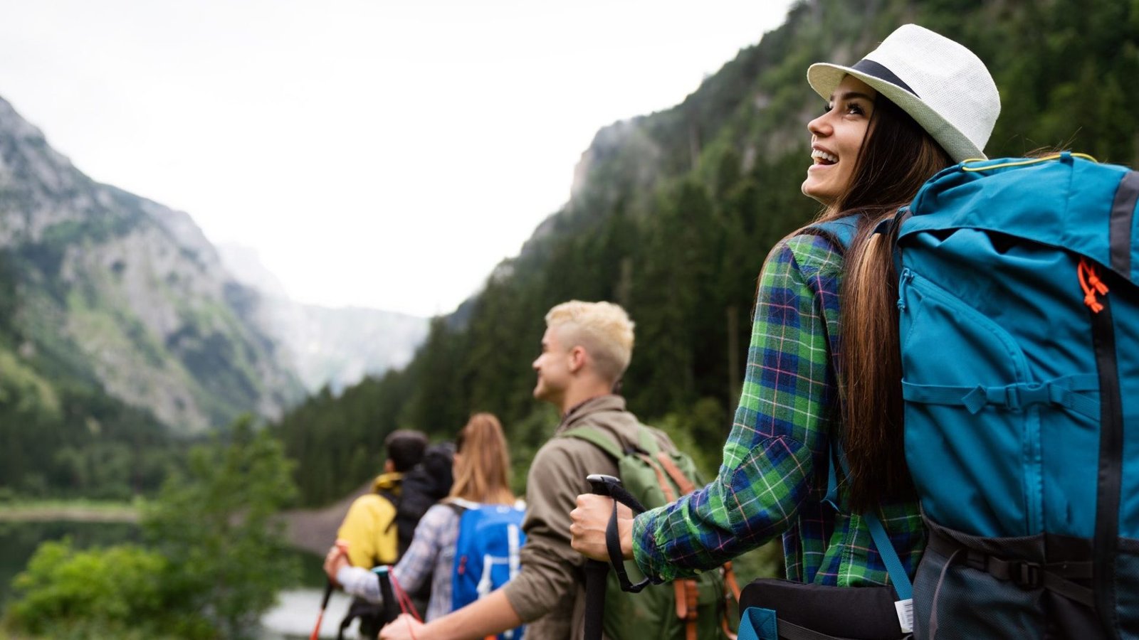 adventure travel tourism hike and people concept group of happy friends with backpack outdoors e1645649774181 Mallku Expediciones